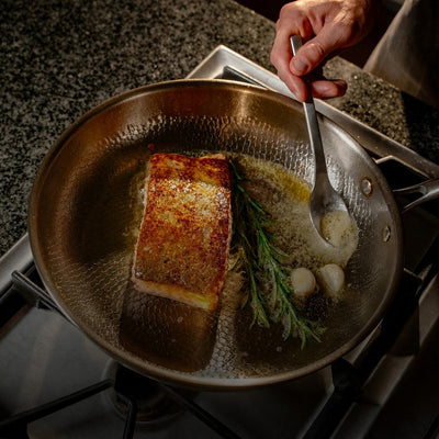 Titanoré Labs Chef's Pan — searing fish with rosemary and garlic