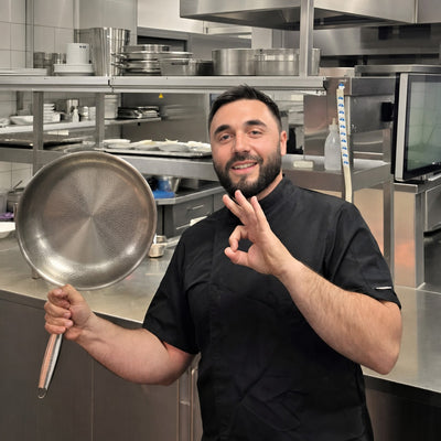 Titanoré Labs Chef's Pan — chef holding the pan