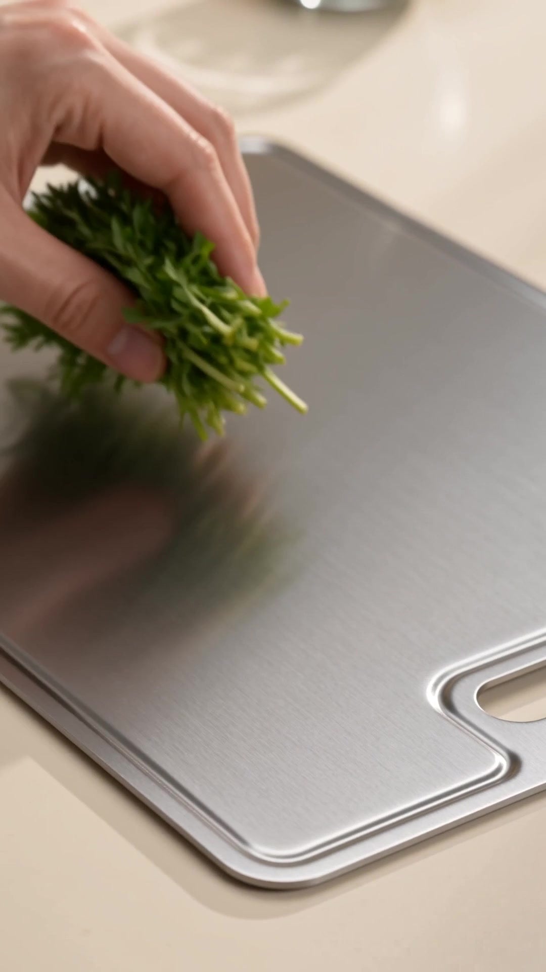 Herb chop detail on solid titanium surface